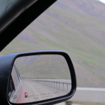 Looking back in the passenger side mirror at the "guard rail".